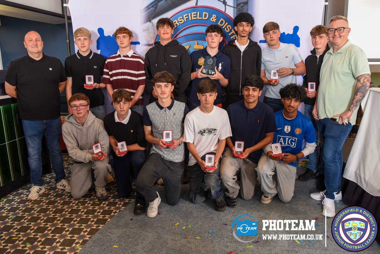 Players with medals and coaches at the awards night