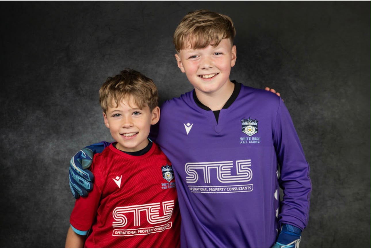 A player and goalkeeper in White Rose kits